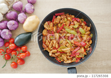 StirFried Chicken with Peppers and Onions is a tasty and nutritious meal option 117265308