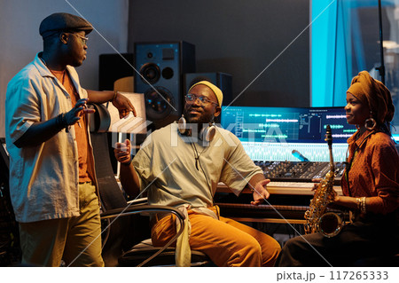 Collaborating in Music Studio with Audio Equipment 117265333