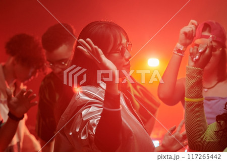 Female dancer moving among her friends 117265442