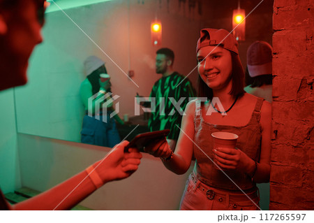 Girl with soda and her boyfriend in club 117265597