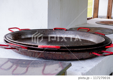 a few large empty paella oven 117270016