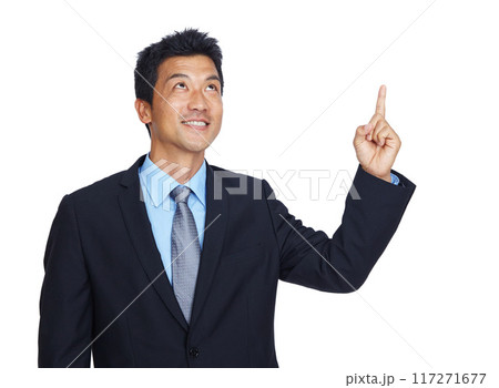 Mockup, pointing and idea with a business asian man in studio isolated on a white background for growth. Marketing, thinking and point with a male employee showing empty mock up on blank space 117271677
