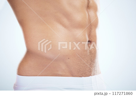 Fitness, wellness and body of man in studio with muscles for healthy lifestyle, workout and bodybuilder training. Motivation, exercise and muscular torso, abdomen and stomach of athlete in underwear Fitness, wellness and body of man in studio with muscles for healthy lifestyle, workout and bodybuilder training. Motivation, exercise and muscular torso, abdomen and stomach of athlete in underwear 117271860