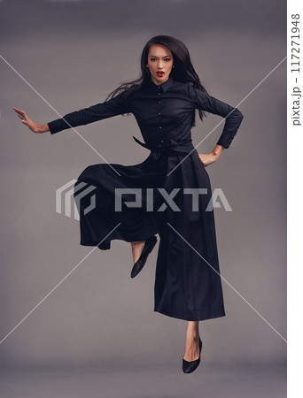Portrait, woman and martial arts training, focus and female isolated on studio background. Lady, girl and ninja with traditional outfit, fitness and workout for practice, warrior and character in air 117271948