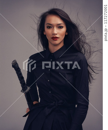Fashion, beauty portrait and warrior woman art with sword to fight for power, cosplay and fantasy. Strong asian female from Japan in black for makeup and cosmetics for samurai or ninja battle Fashion, beauty portrait and warrior woman art with sword to fight for power, cosplay and fantasy. Strong asian female from Japan in black for makeup and cosmetics for samurai or ninja battle 117272001