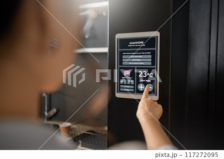 Smart home, IOT wall system and woman with digital app monitor for thermostat heating, temperature control or air conditioning. House automation, future AI software and girl with interactive ui tech Smart home, IOT wall system and woman with digital app monitor for thermostat heating, temperature control or air conditioning. House automation, future AI software and girl with interactive ui tech 117272095