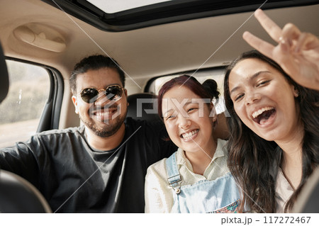 Travel, road trip and car with people or friends portrait excited for journey, holiday or vacation together. Gen z group of people with peace sign driving for safety, transportation and adventure 117272467