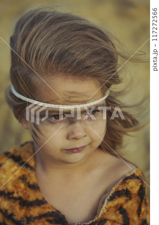 Cute baby dressed in the clothes of primitive people Cute baby dressed in the clothes of primitive people 117272566