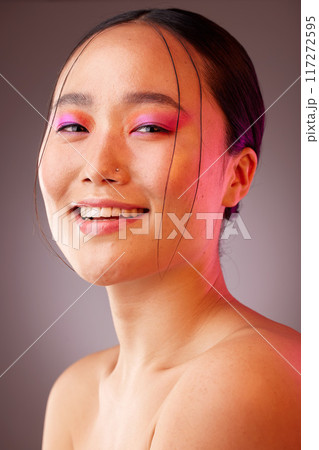 Face, makeup and beauty with a model asian woman in studio on a gray background to promote a cosmetic product. Luxury, wellness and portrait with an attractive young female posing for cosmetics 117272595