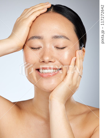 Skincare, beauty and woman with a smile in a studio with cosmetic, face and dermatology treatment. Happiness, joy and girl model from Japan with healthy, wellness and clean skin with a facial routine Skincare, beauty and woman with a smile in a studio with cosmetic, face and dermatology treatment. Happiness, joy and girl model from Japan with healthy, wellness and clean skin with a facial routine 117272642