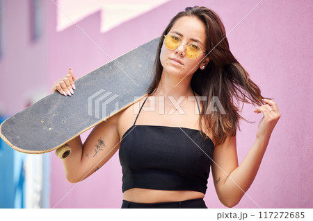 Portrait of woman, sunglasses and skateboard retro look in urban city on street style adventure. Young asian trendy skater girl, gen z or millennial lifestyle and fun modern edgy fashion outdoors 117272685