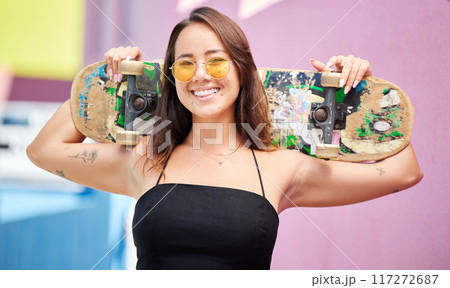 Skateboard, cool woman and gen z skater girl with trendy sunglasses outside for skate or skateboarding sport in city. Portrait of fashion female enjoy skating hobby, recreation and fun in Singapore Skateboard, cool woman and gen z skater girl with trendy sunglasses outside for skate or skateboarding sport in city. Portrait of fashion female enjoy skating hobby, recreation and fun in Singapore 117272687