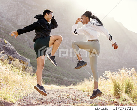 Fitness, nature and couple exercise in mountain hill, jump wellness and outdoor cardio workout on dust path. Motivation, health and sport partnership or friends in sports training or active lifestyle 117272723