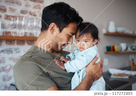 Baby, father and love while bonding and sharing a precious moment between infant girl and dad parent hugging and showing love, care and support at home. Happy man with cute child in their India house 117272803
