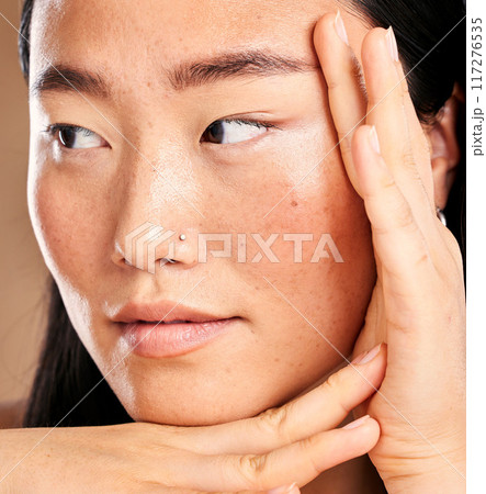 Closeup face, hand frame and asian woman in studio with skincare, skin glow or healthy cosmetics. Happy japanese model, cosmetic beauty and aesthetic with self care health, wellness or natural makeup Closeup face, hand frame and asian woman in studio with skincare, skin glow or healthy cosmetics. Happy japanese model, cosmetic beauty and aesthetic with self care health, wellness or natural makeup 117276535