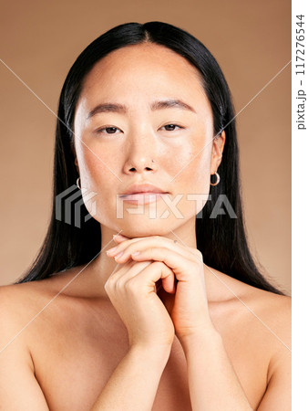 Beauty, portrait or face of Japanese woman or model in with glowing skin isolated on studio background. Tokyo, skincare or beautiful Asian girl with luxury facial treatment self care routine results 117276544