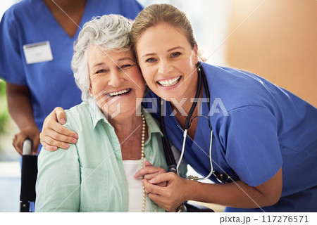 Shes well cared for. Portrait of a smiling nurse with her senior patient in a hospital. 117276571