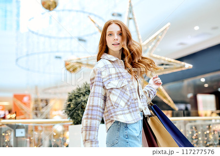 beautiful awesome woman girl holds colourful shopping packages 117277576