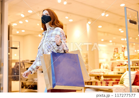 active ginger woman is rushing for sales 117277577