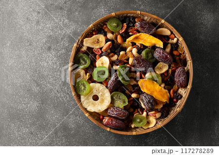 Dried tropical fruits with various nuts and raisins. Dried tropical fruits with various nuts and raisins. 117278289