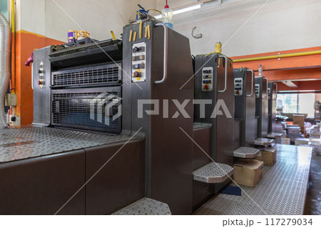 Offset machines. Large printing machine perspective. printing machine cylinders Offset machines. Large printing machine perspective. printing machine cylinders 117279034