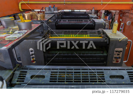 Offset machines. Large printing machine perspective. printing machine cylinders Offset machines. Large printing machine perspective. printing machine cylinders 117279035