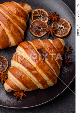 Delicious crispy sweet croissant cornet with chocolate 117280929