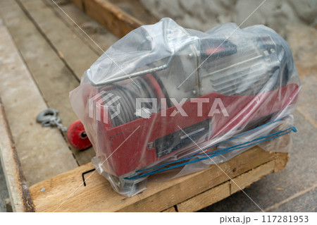 Electric winch is securely wrapped and awaiting installation at the site Electric winch is securely wrapped and awaiting installation at the site 117281953