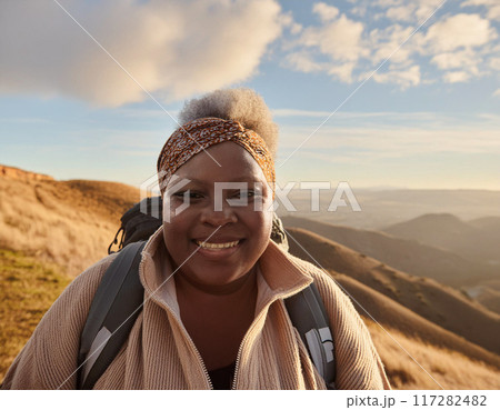 Happy Solo Female Hiker on Mountain Trail: One Woman Smiling 117282482