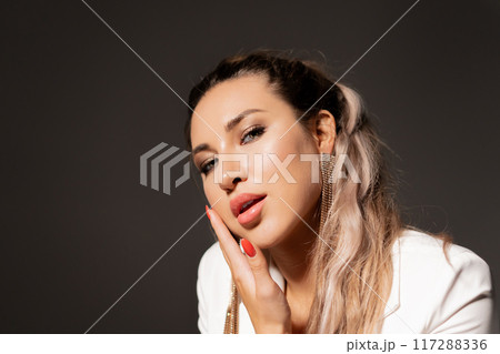 Close-up of a young girl's face with a clean face and light makeup. Beauty treatment concept with space for text 117288336