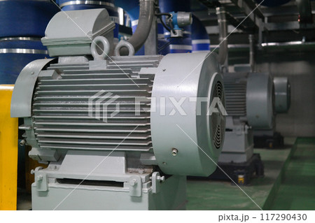 Industrial electric motors in a power plant, closeup of photo Industrial electric motors in a power plant, closeup of photo 117290430