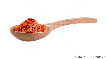 pile of red pepper in wood spoon on white background 117290573