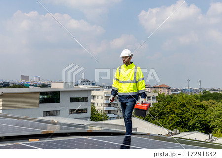 Engineer service check installation solar cell on the roof of factory Engineer service check installation solar cell on the roof of factory 117291832