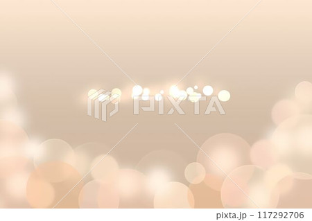 ベージュ色の背景に光り輝く丸いボケ ベージュ色の背景に光り輝く丸いボケ 117292706