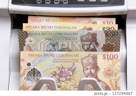Brunei dollar in the counting machine 117294887
