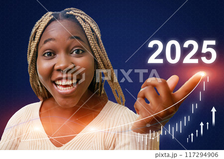 A woman with long hair is pointing to the year 2025 A woman with long hair is pointing to the year 2025 117294906