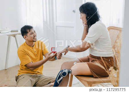man making a proposal while giving an engagement ring man making a proposal while giving an engagement ring 117295775