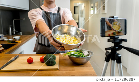 The chef is broadcasting live from workshop how to prepare a vegetarian food The chef is broadcasting live from workshop how to prepare a vegetarian food 117296887