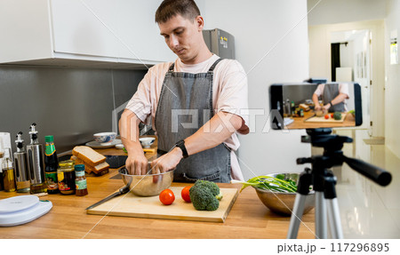 The chef is broadcasting live from workshop how to prepare a vegetarian food 117296895