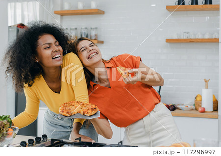 Pride LGBT Family at the kitchen Happy face. Preparing family dinner at home Pride LGBT Family at the kitchen Happy face. Preparing family dinner at home 117296997