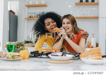 Pride LGBT Family at the kitchen Happy face. Preparing family dinner at home 117297007