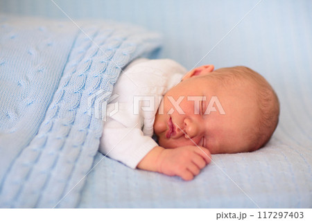 Newborn baby boy on a blue blanket Newborn baby boy on a blue blanket 117297403