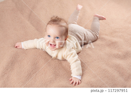 Little baby on white bed Little baby on white bed 117297951