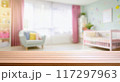 Empty wooden table with blurry baby room background, for design and decoration concepts 117297963