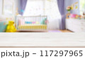 Empty wooden table with blurry baby room background, for design and decoration concepts 117297965