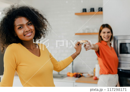 Happy smiling family having fun cooking at kitchen together 117298171