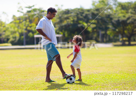 Father and son play football. Young active family. 117298217