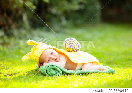 Baby in cute dress up costume. Newborn in garden. Baby in cute dress up costume. Newborn in garden. 117298415