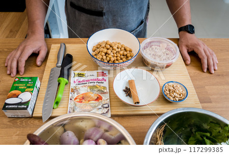 Chef at the kitchen preparing massaman curry with sweet potato and many spices 117299385