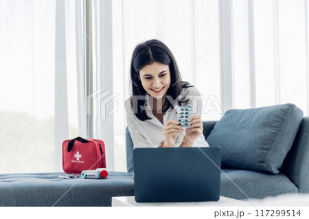 Woman sit down on sofa. healthcare virus protection. health and fever concept. Woman sit down on sofa. healthcare virus protection. health and fever concept. 117299514
